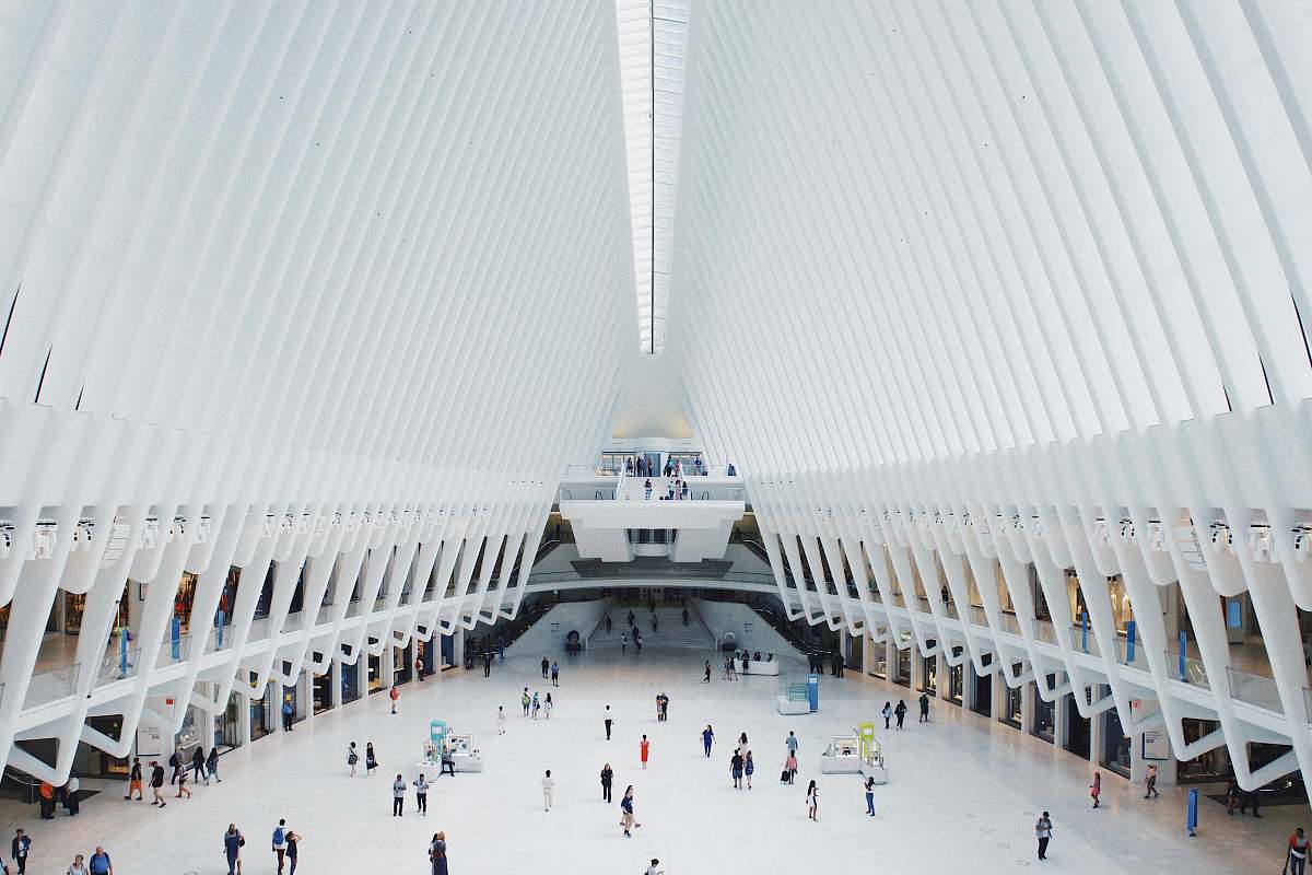 oculus group of people standing inside hall architecture